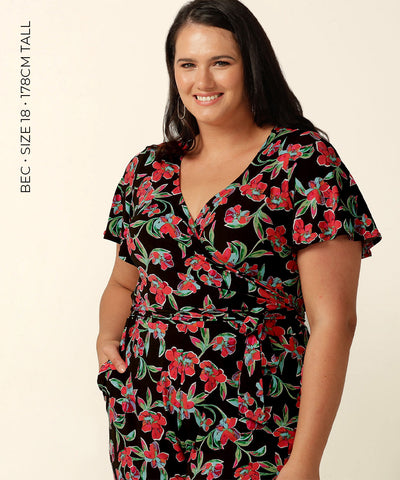 Wrap-front stretch jersey jumpsuit with short flutter sleeves and wide cropped legs. Featuring an exclusive colourful floral print, this jumpsuit is made in Australia for plus size women, petite women and women looking to build a capsule wardrobe.