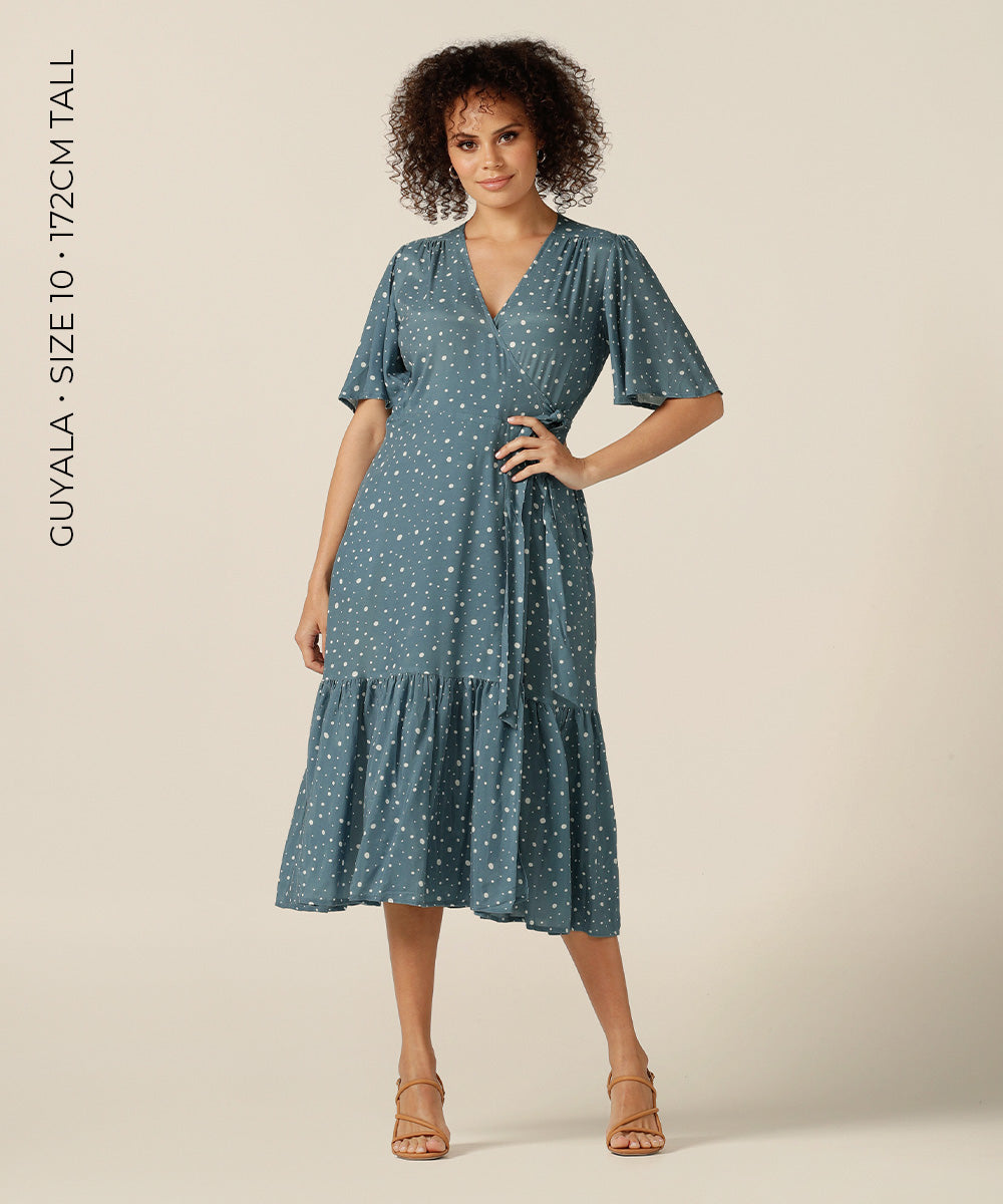 tailored wrap dress with pockets made from breathable fabric.