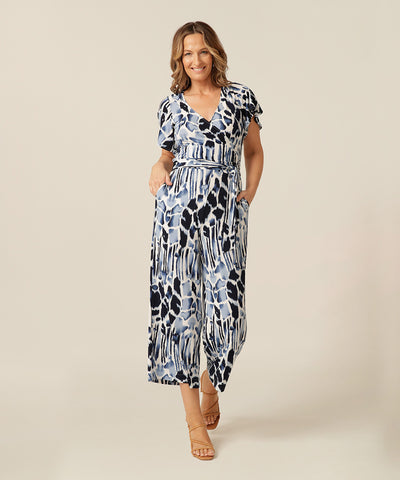 Pockets on the jersey jumpsuit with flutter sleeves, wrap bodice and cropped length. Made in Australia for petite to plus size women. 