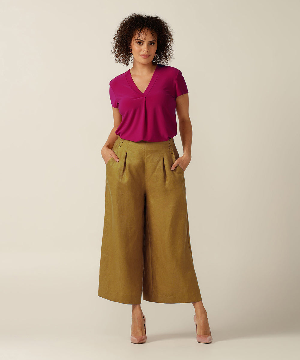 100% linen sailor front, wide legged pant with tailoring details.