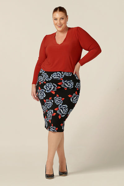 A great skirt for work and corporate wear, the Andi Skirt in Ikebana is a tube skirt in stretch jersey fabric. A black skirt with blue and orange floral pattern, this modern print matches well with black and navy separates. Shop this skirt in an inclusive size range of 8-24. 