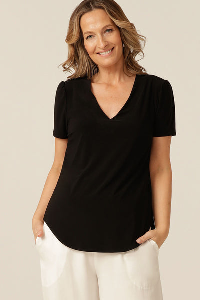 tailored short sleeve top with v-neckline and shirttail hemline