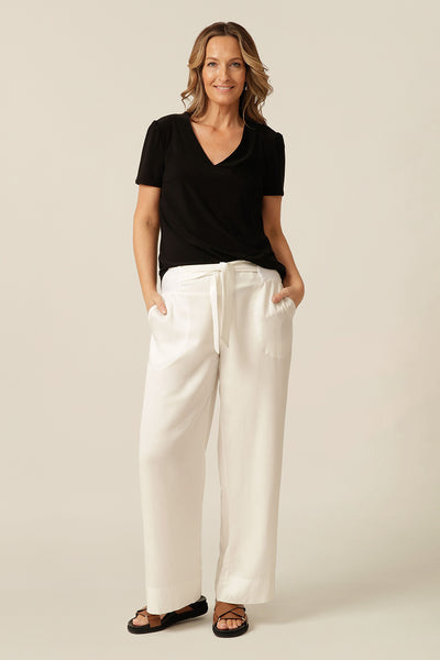 tailored short sleeve top with v-neckline and shirttail hemline