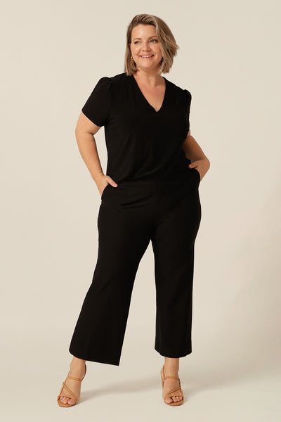 tailored short sleeve top with v-neckline and shirttail hemline