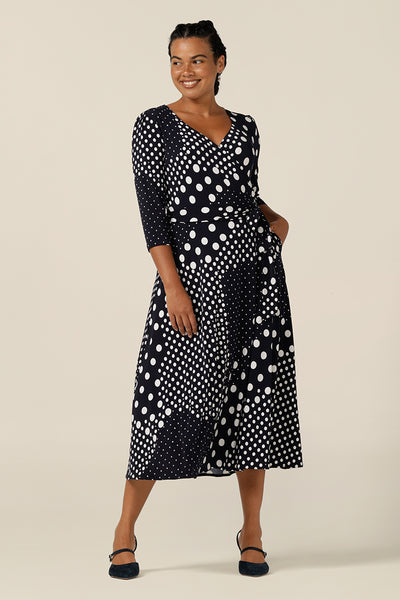 A jersey wrap dress with navy and white dot print, this is a great work wear and going-out dress. Featuring 3/4 sleeves and a full, midi length skirt, this wrap dress was made in Australia by Australian and New Zealand women's clothing brand, L&F.