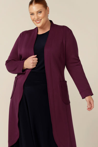 A good lightweight coat for fuller figures, the stretch modal of this wine red trenchcoat by Australia and New Zealand women's clothing label, L&F fits well for all shapes and sizes. Layer over your workwear as a good winter coat for the office.