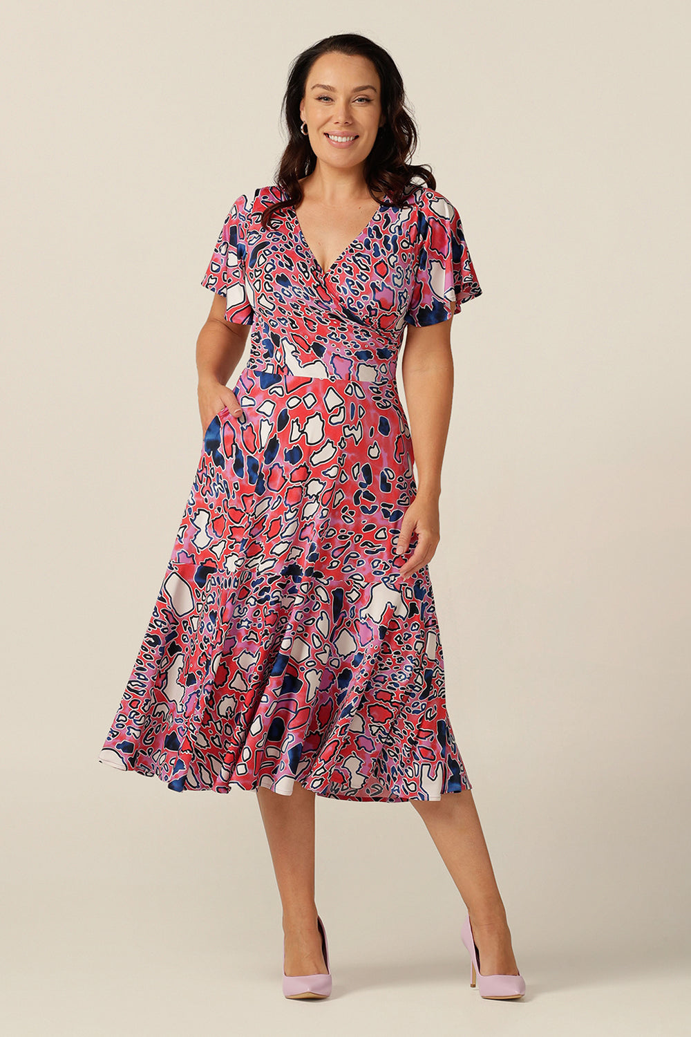 fixed wrap jersey dress with flutter sleeves, pockets and ruffle on skirt.