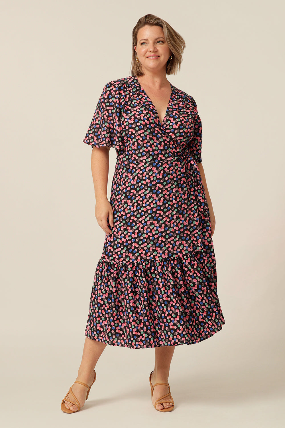 tailored wrap dress with flutter sleeves and  pockets made from breathable fabric. Made in Australia for petite to plus size women.