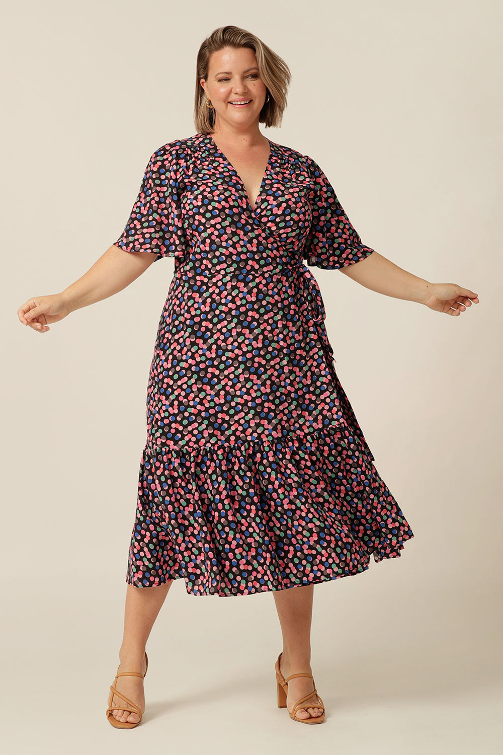 tailored wrap dress with flutter sleeves and  pockets made from breathable fabric. Made in Australia for petite to plus size women.