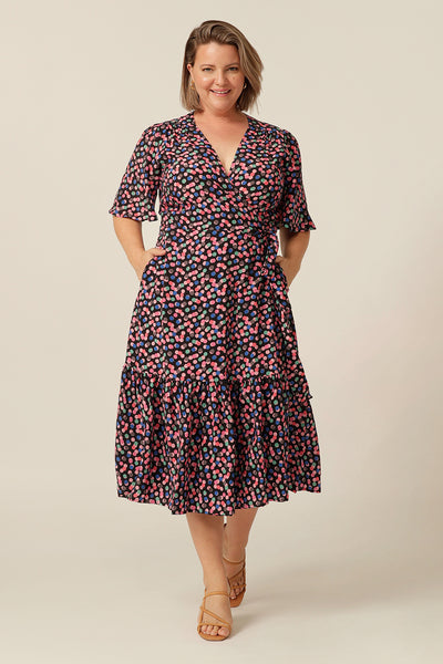 tailored wrap dress with flutter sleeves and  pockets made from breathable fabric. Made in Australia for petite to plus size women.