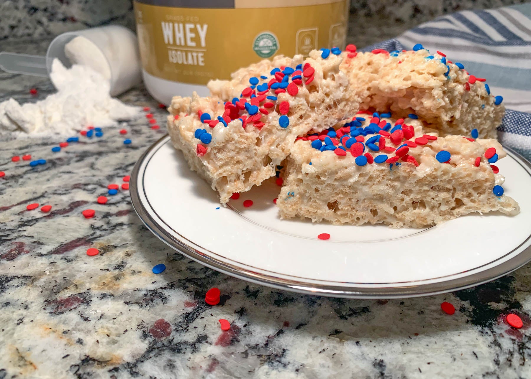 Pounamu Protein 4th of July Protein Rice Krispie Treats with red and blue sprinkles on top