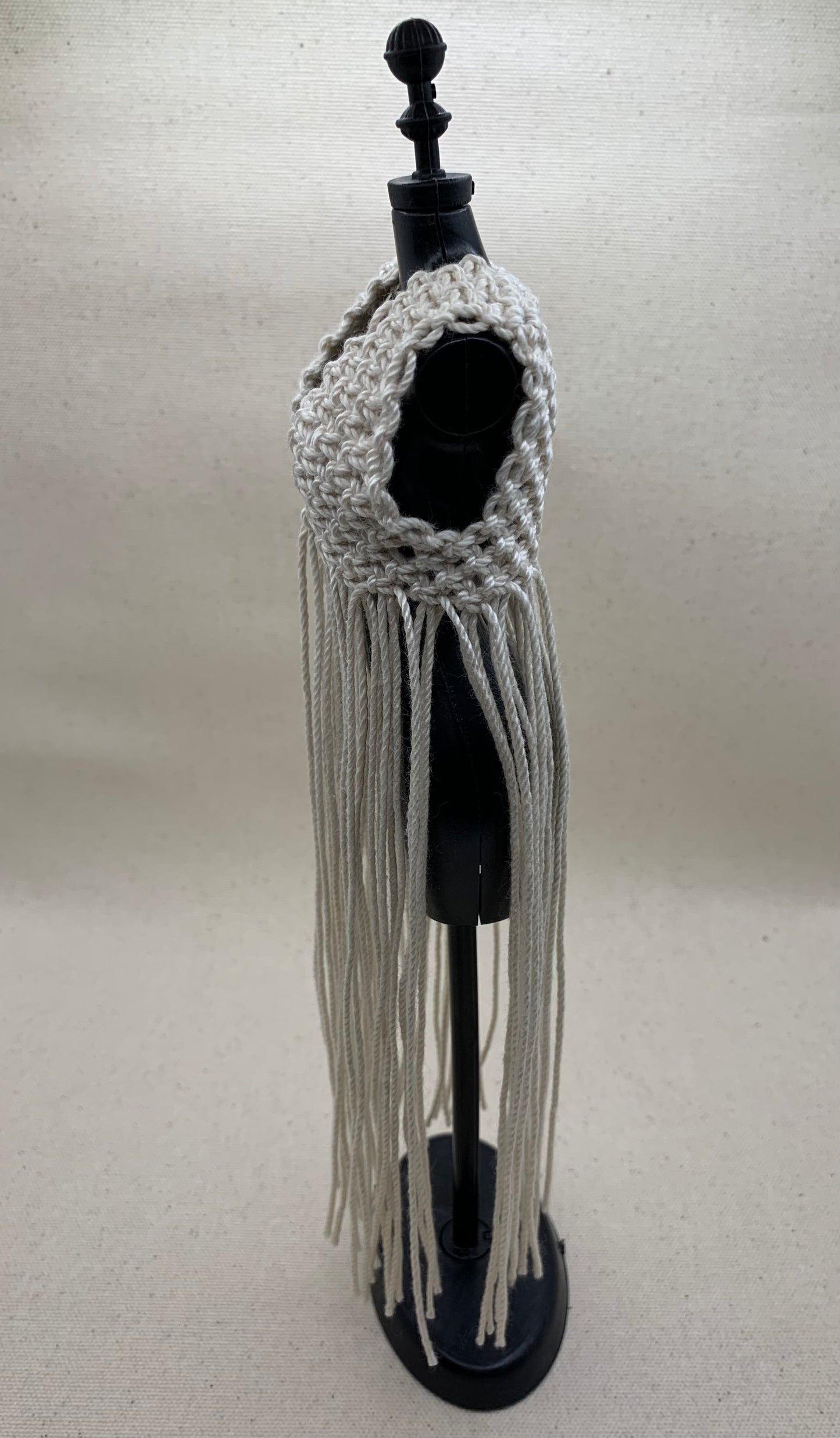 Side View 1/6 Scale macrame vest with long fringe in natural color.