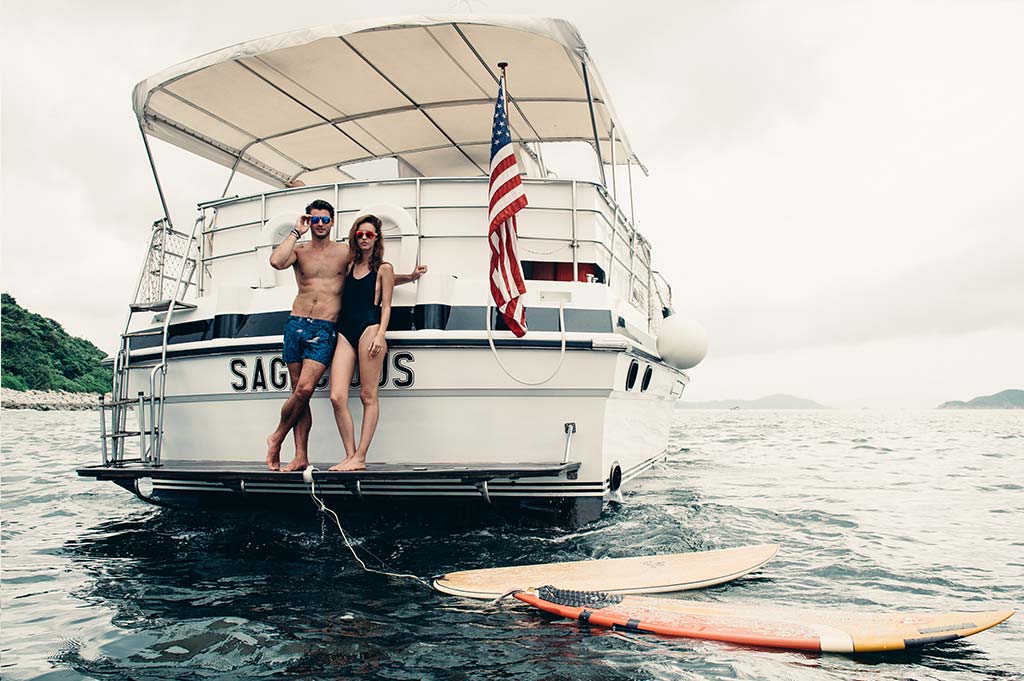 Male and Female model wearing Baendit on a boat 