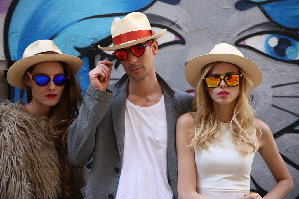 Three models wearing Baendit sunglasses in hats