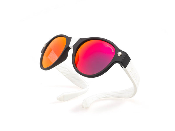 black frames with red lenses and white arms