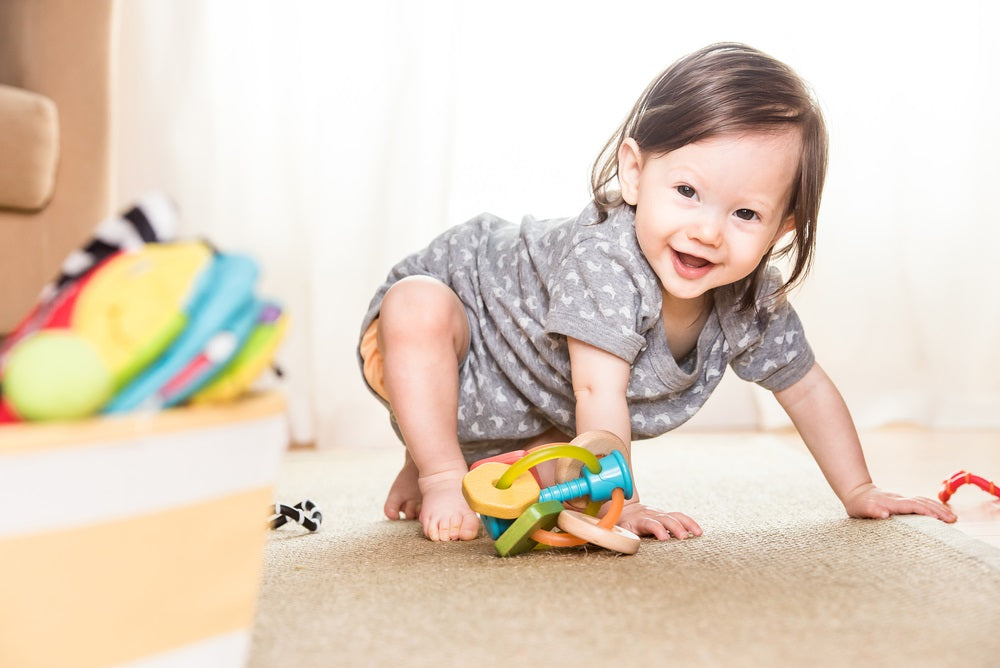 crawling baby learning to use her feet