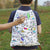 The World Map Backpack displayed along with its included wash-out fabric pens.