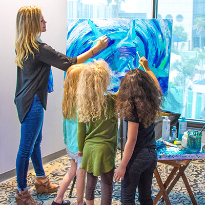 Kelly Quinn painting with kids