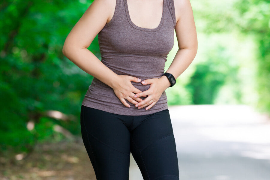 Woman experiencing incontinence while working out