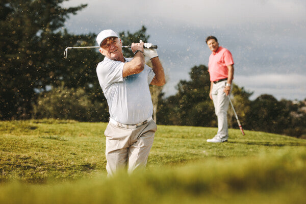 Men playing golf