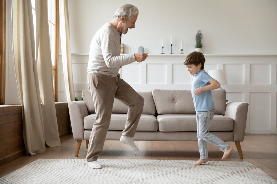 Grandfather playing with grandson