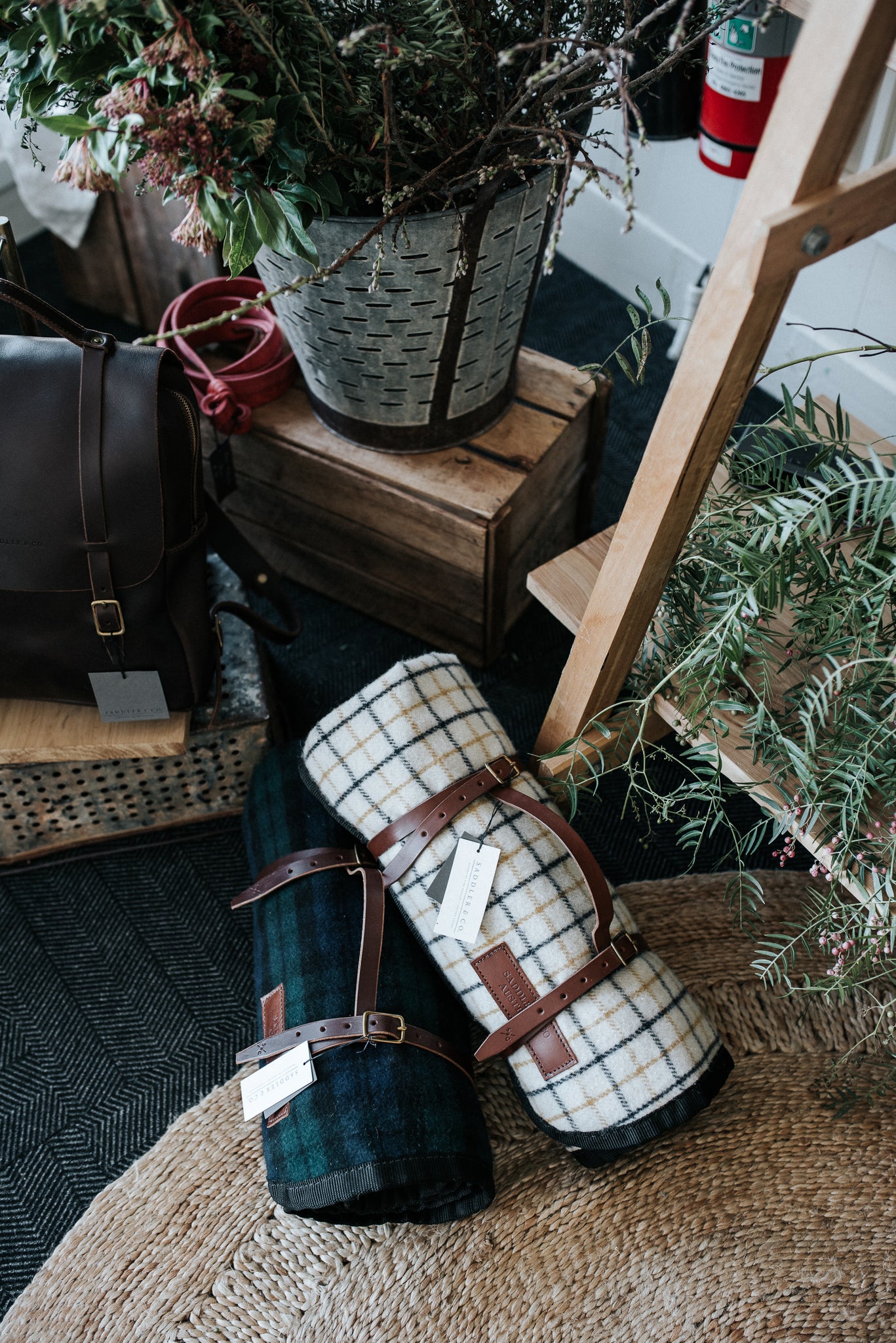 Wool and leather Picnic blankets in Wellington Popup shop, featuring Armadillo & Co rug