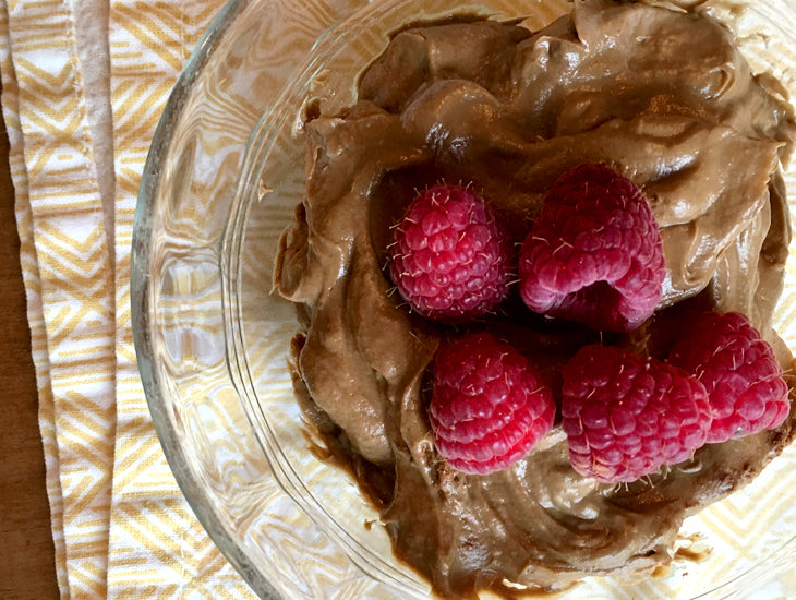 Blended avocado mousse with raspberries