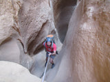 Nik rappelling into Cable Canyon