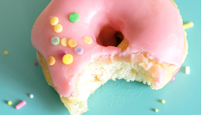 Pink glazed donut - tempting but not healthy
