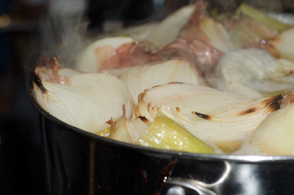 Simmering vegetables and bones.