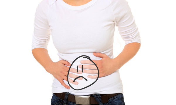 Celiac twists your guts; unhappy woman holds stomach