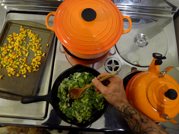 Peppers, onions, and butternut squash in a cast iron pan