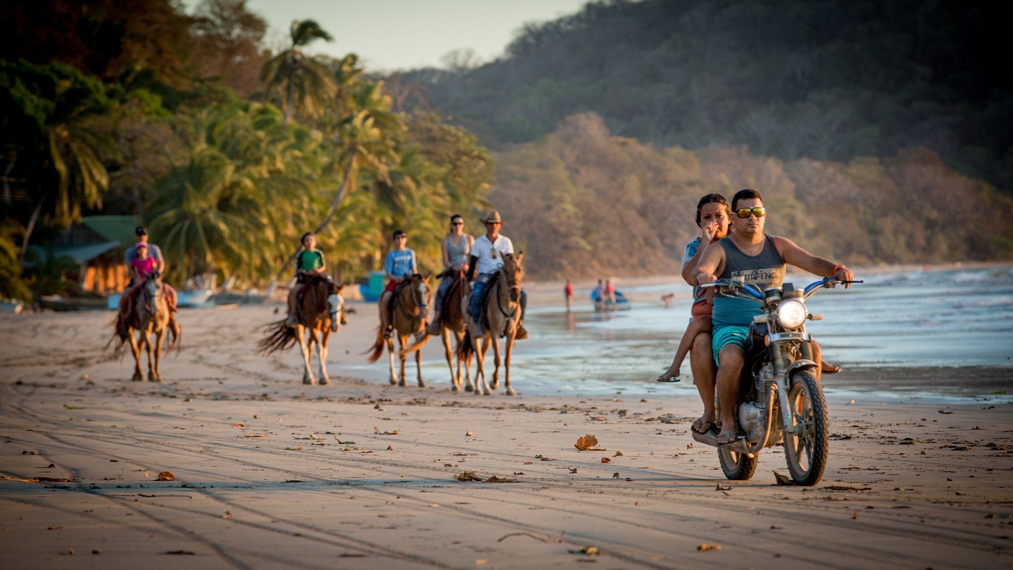 horses and motorcycles on the beach