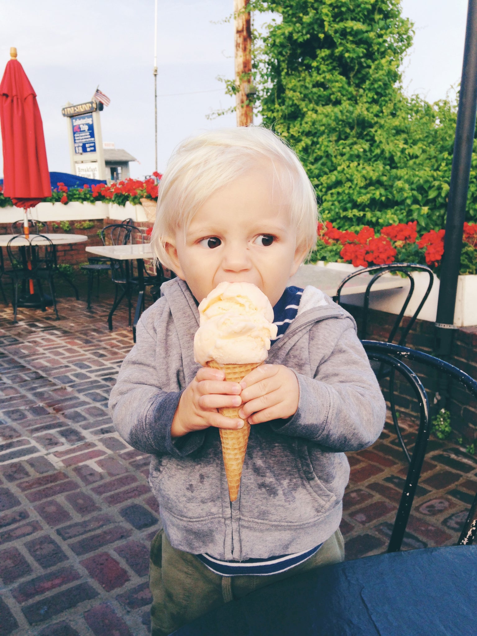 Little boy eating ice cream in Maine