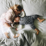 cutest siblings having an afternoon nap. Little Theo wearing natural bodysuit from roots & wings merino