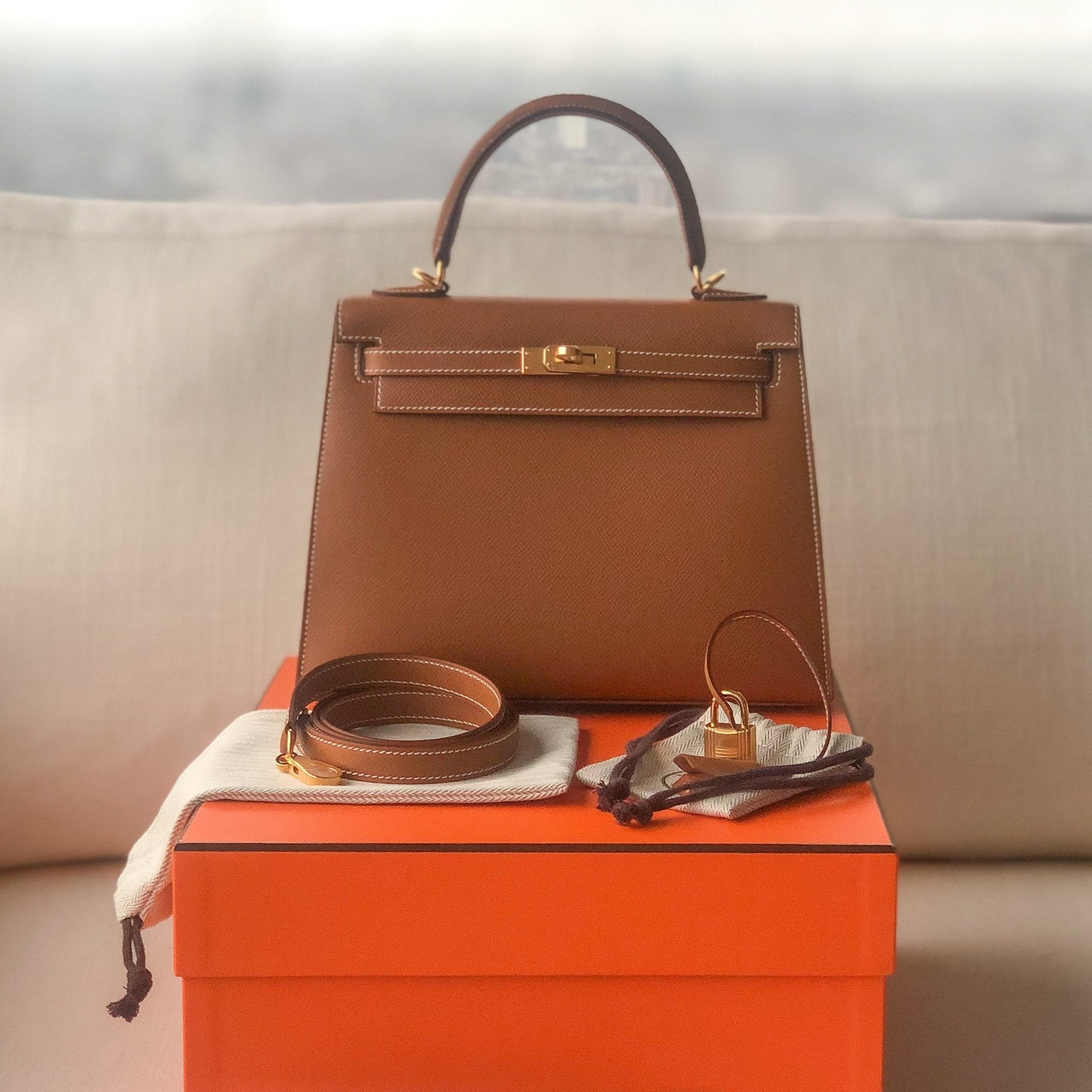 A GOLD EPSOM LEATHER SELLIER KELLY 25 WITH GOLD HARDWARE, HERMÈS, 2022