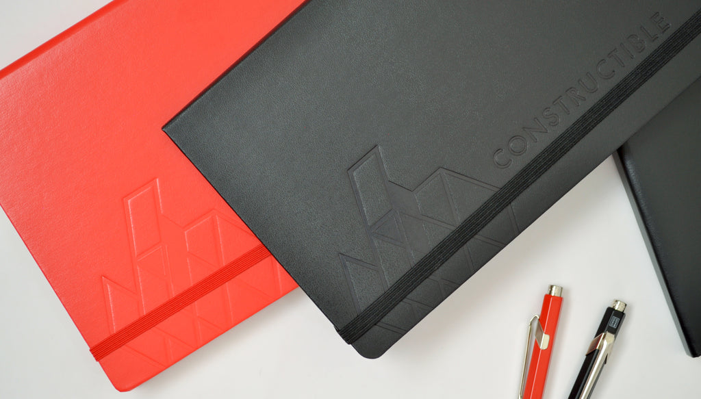 Constructible notebooks with custom embossed logo imprints