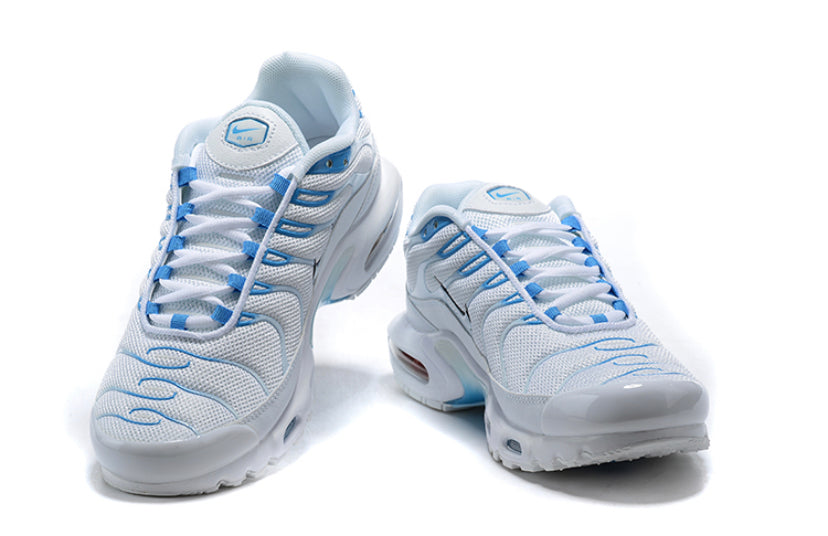 white tns with blue tick