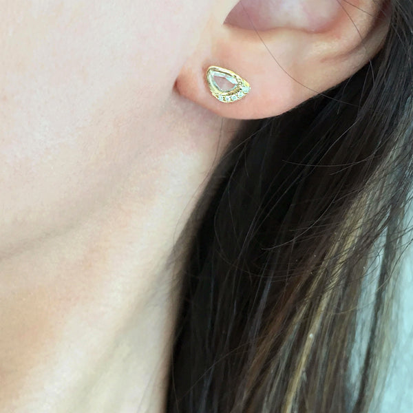 handcrafted earring on model's ear 