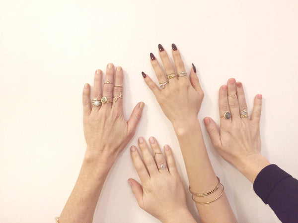 Misa Jewelry handcrafted rings on model's hands 