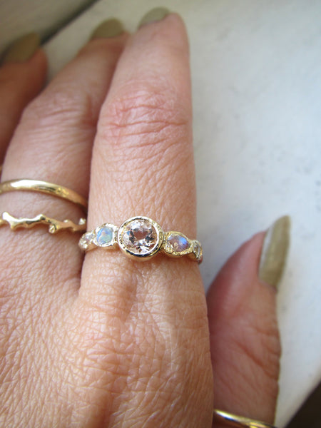 3 yellow gold handcrafted rings on model's hand 