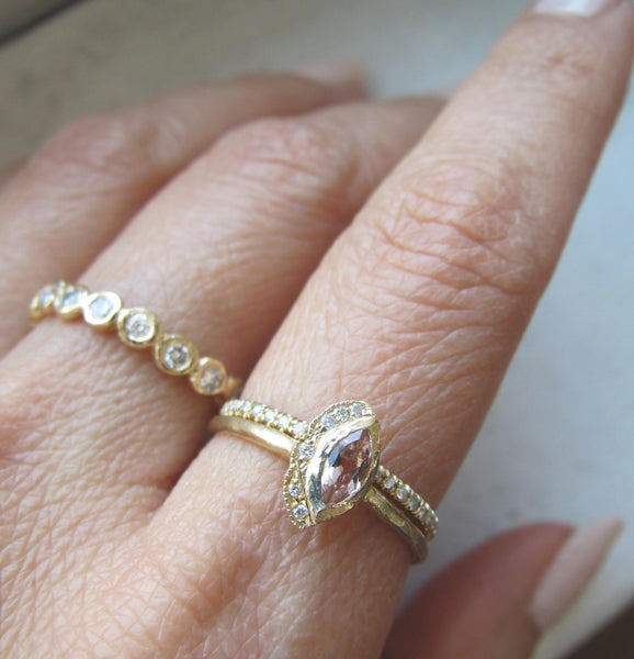 2 morganite handcrafted rings on model's hand 