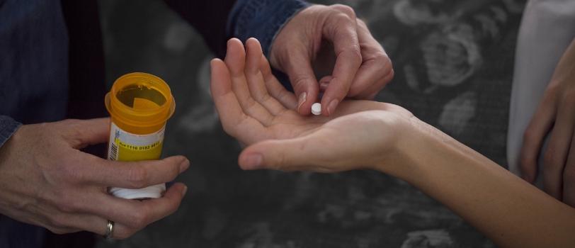 Husband giving a loved one prescribed opioid