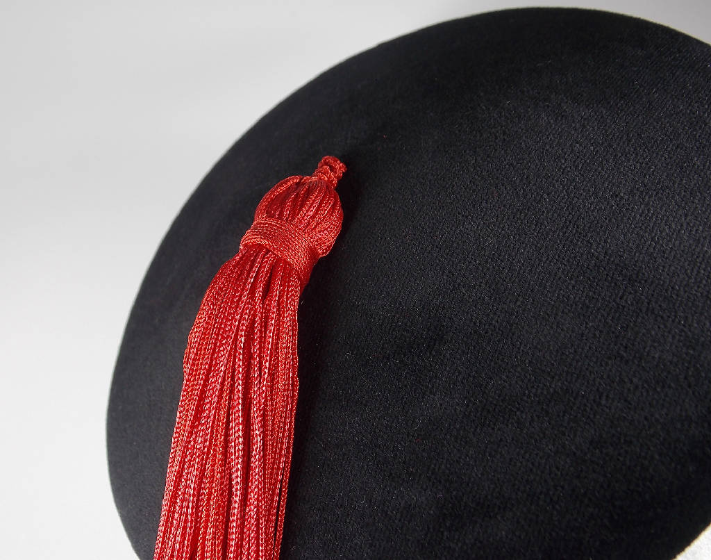 small red hat with tassel