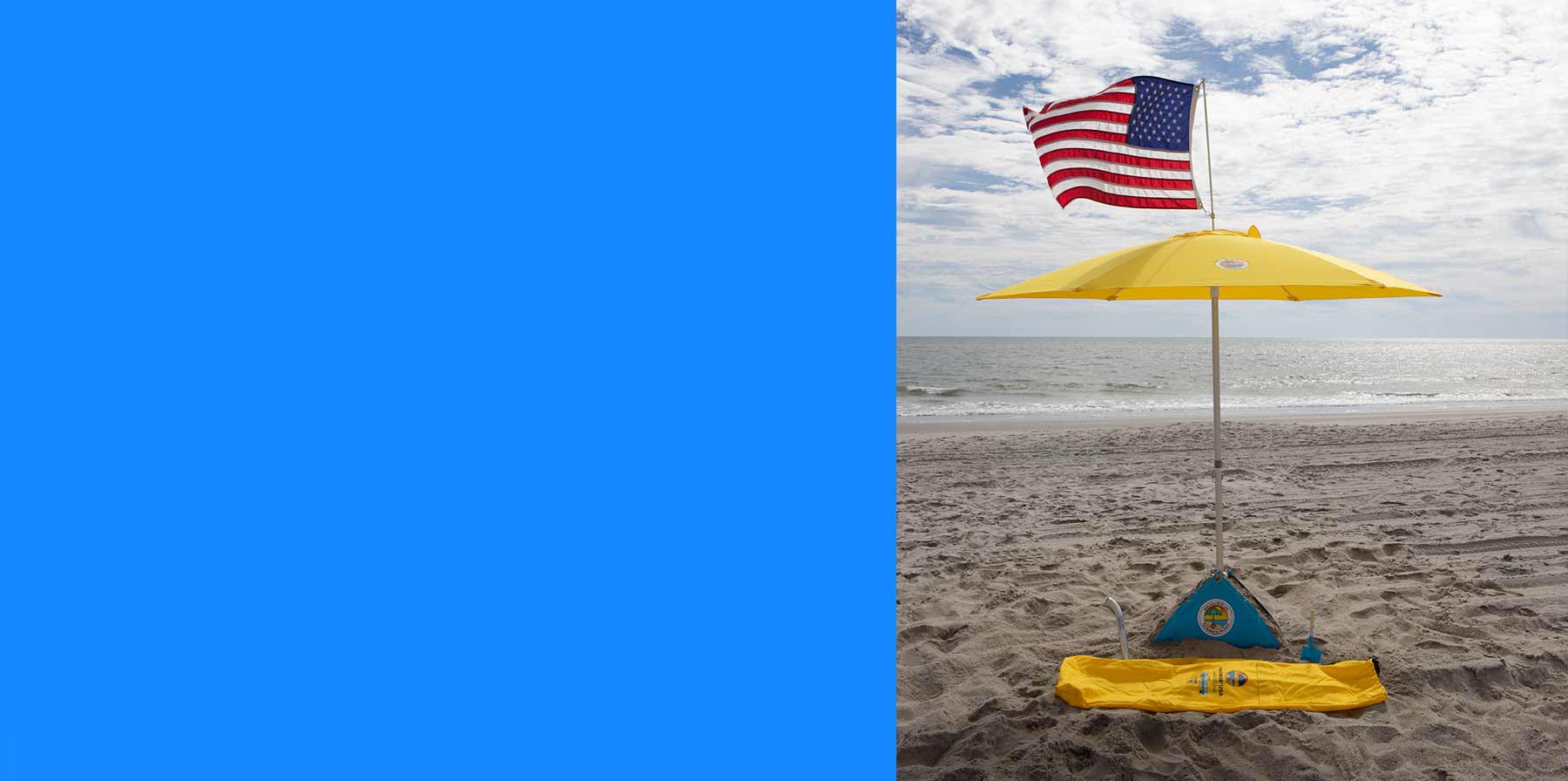 beachBUB wind resistant umbrella on the beach with an american flag accessory