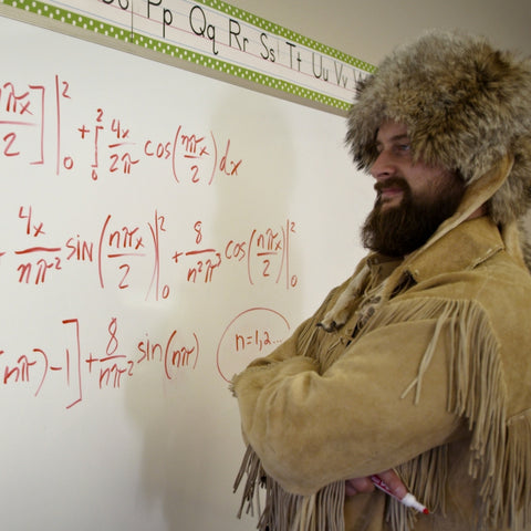 Old Trapper at Chalkboard with Math Problem