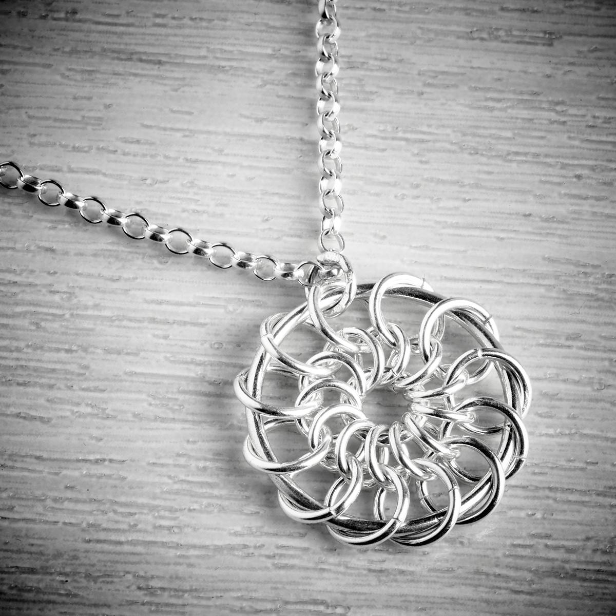 Silver Catherine Wheel Pendant By Laura Brookes Emma White And The
