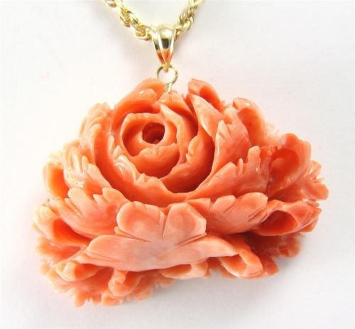 carved flower pendant