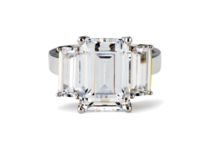 emerald cut trilogy diamond ring