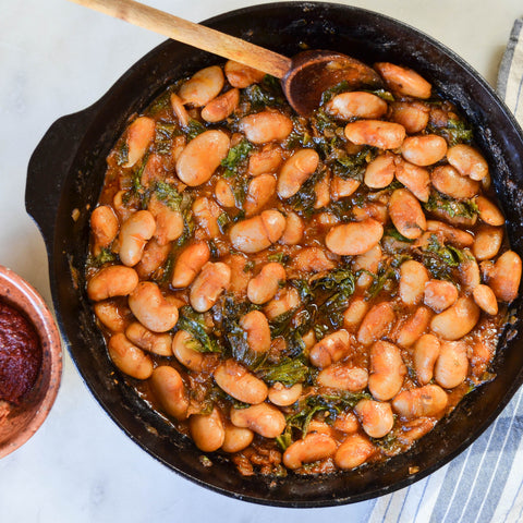 Braised White Beans and Greens with Harissa